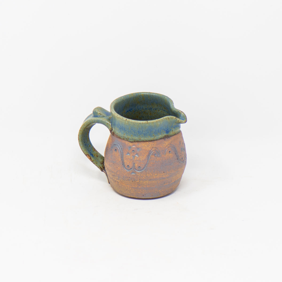 http://www.tokheim-stoneware.com/cdn/shop/products/Tokheim-Stoneware-North-Star-Pitcher-Green_1200x1200.jpg?v=1624385901